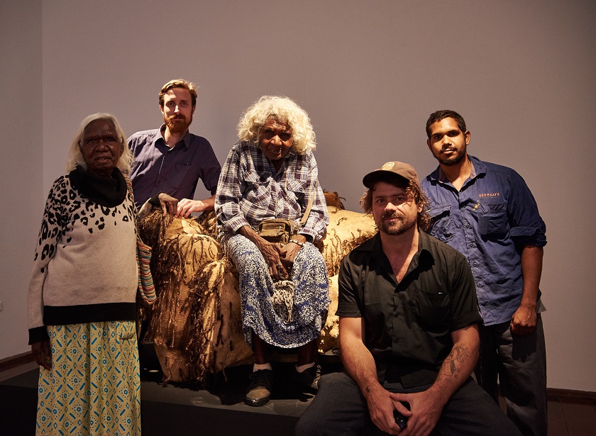 Artists Mayarn Lawford, Trent Jansen, Rita Minga and Illium Nargoodah in the back row and Mangkaja Studio Coordinator Wes Maselli in the foreground at In Cahoots exhibition opening. Photography by Rebecca Mansell.