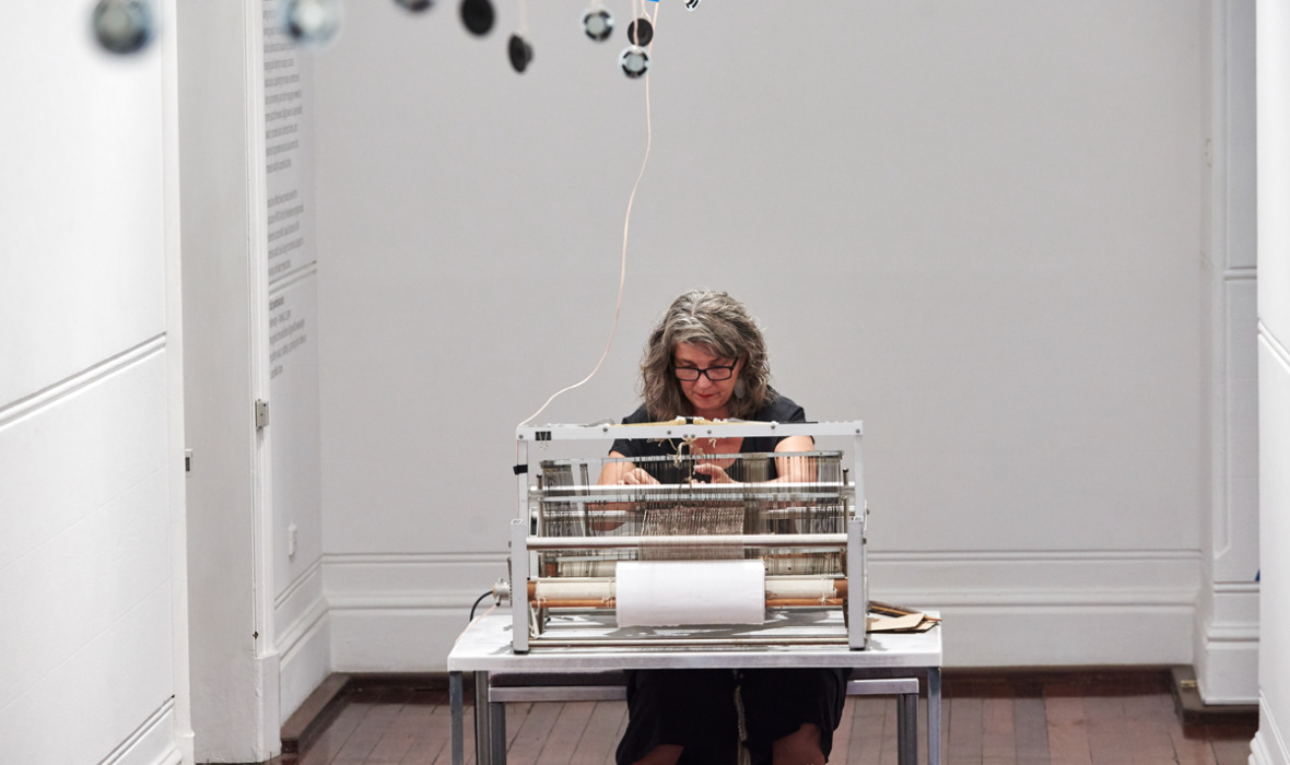 Olga Cironis, Mountain of Words, 2017, metal loom, table and chair, sensors, speakers and amp, human hair, natural fibre, performance. Photo by Rebecca Mansell