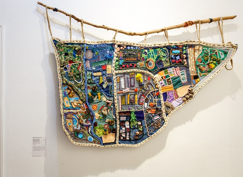 Janine Solomon, Adella May Ryder, Neroli Blurton, Catherine Bynder, Raelee Cook, Linda Carlsson, Anne Oxenham, Getrina Hayden, Patricia Websdale, Normae Bennett, Beverley Riley, Kurghan Poki, Fiona Mallinson, Langford Map, 2018, recycled fabric, denim, cotton, wool, bark, beads, felt, canvas acrylic artwork pieces, gum nuts, buttons, and organic found materials, 140 x 180cm. Photography by Jessica Wyld