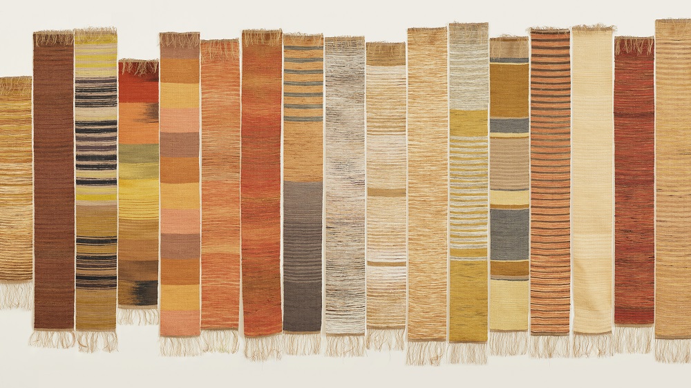 Liz Williamson Weaving Eucalypts Project (70 panels) (detail), 2020-2021 silk dyed by artists in Australia, India and Bangladesh with locally sourced eucalyptus leaves, bark or twigs; silk hand woven as weft into a linen and cotton warp dimensions variable